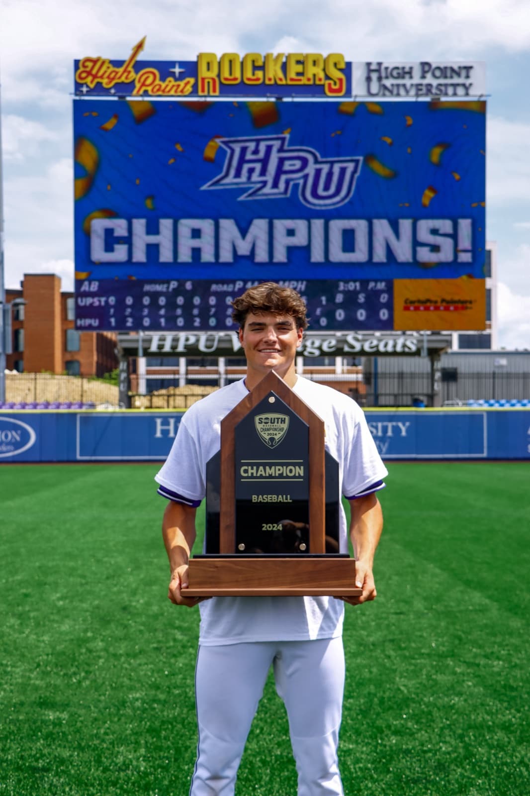 Holding the 2024 conference championship trophy at High Point